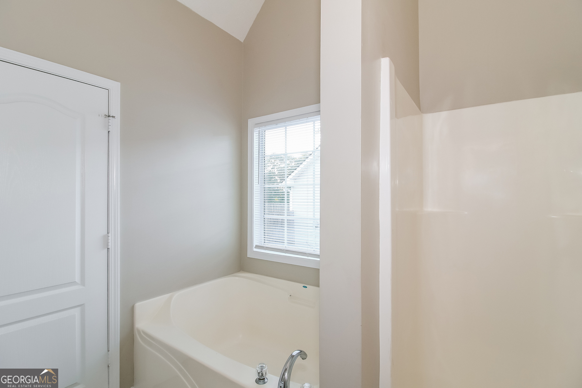 3399 Bells Landing Drive Rex, GA 30273 - Photo 10 of 16 a bathroom with a bathtub and window