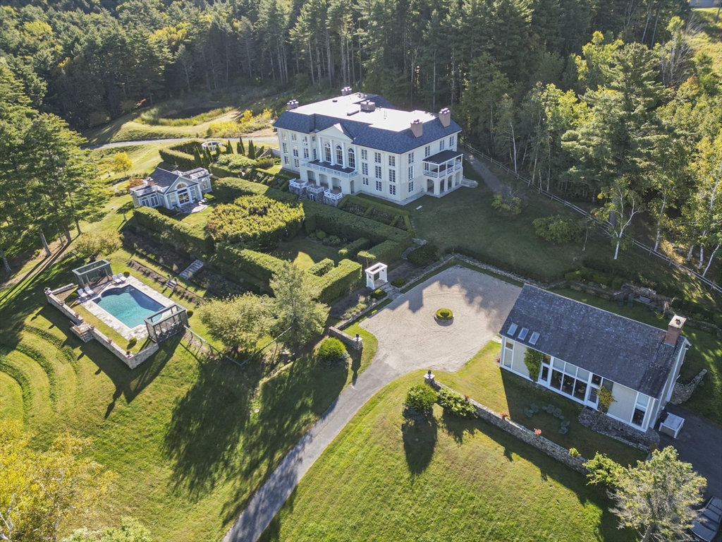 209 Blue Hill Road Great Barrington, MA 01230 - Photo 2 of 42 a view of a swimming pool with a patio