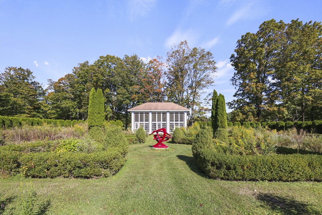 209 Blue Hill Road Great Barrington, MA 01230 - Photo 31 of 42 a front view of a house with a yard