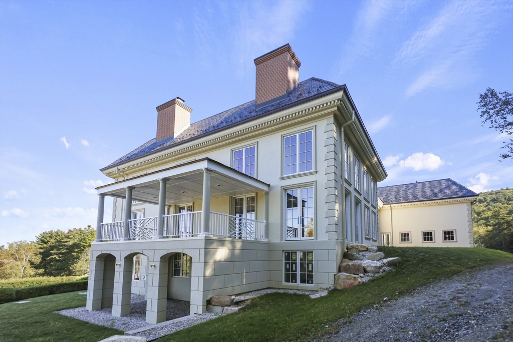 209 Blue Hill Road Great Barrington, MA 01230 - Photo 40 of 42 a front view of a house with garden