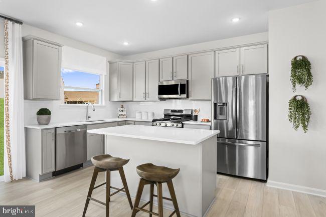 6 Eddy Road Inwood, WV 25428 - Photo 6 of 17 a kitchen with stainless steel appliances a refrigerator stove microwave and sink