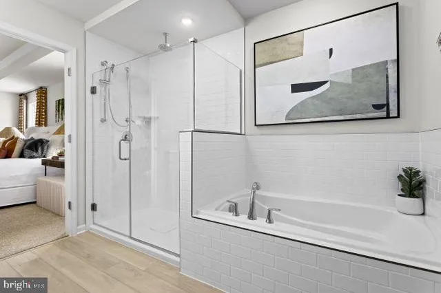 a bathroom with a tub and a shower