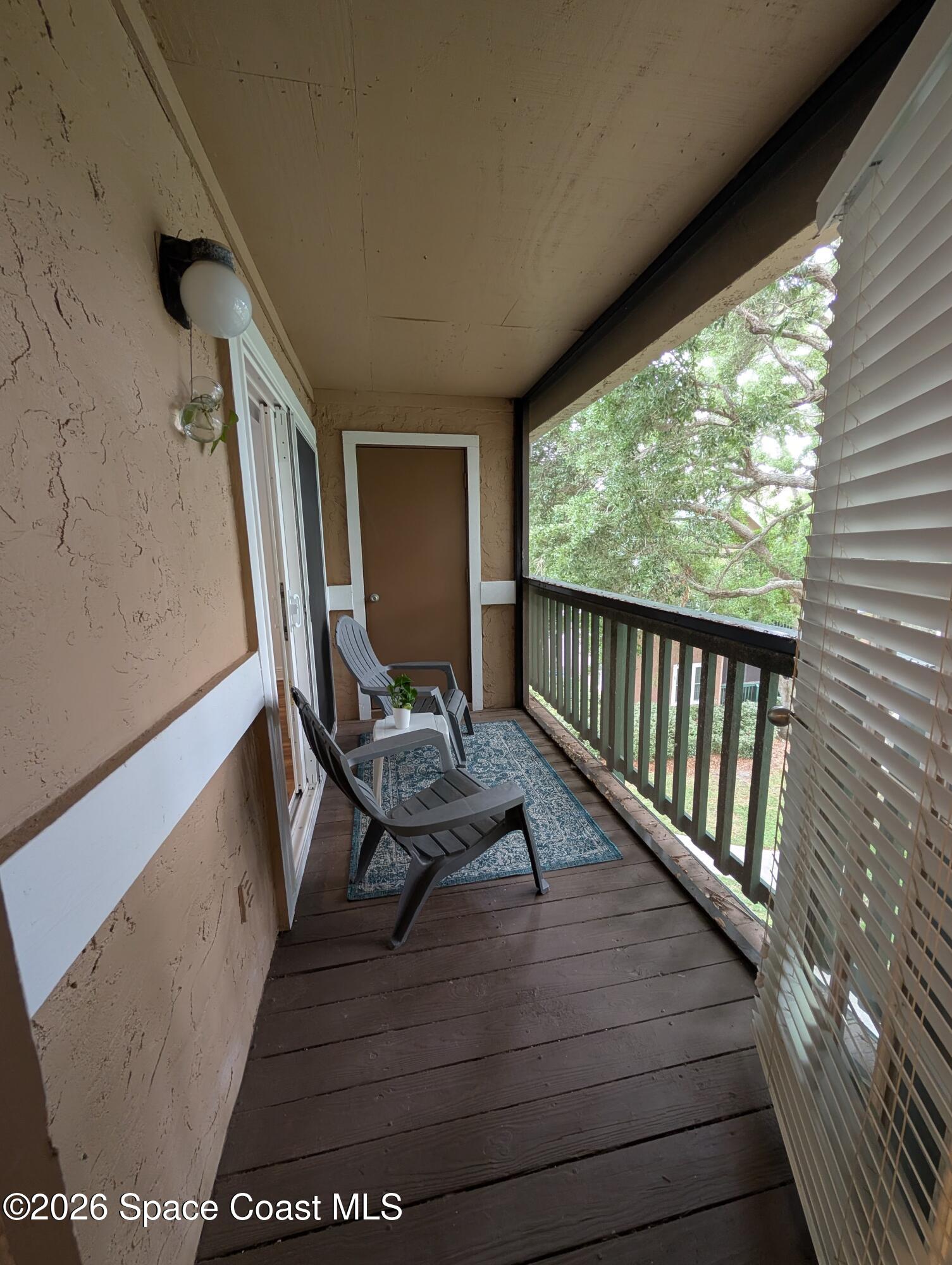 7667 North Wickham Road, Unit 818 Melbourne, FL 32940 - Photo 14 of 29 a view of balcony with furniture