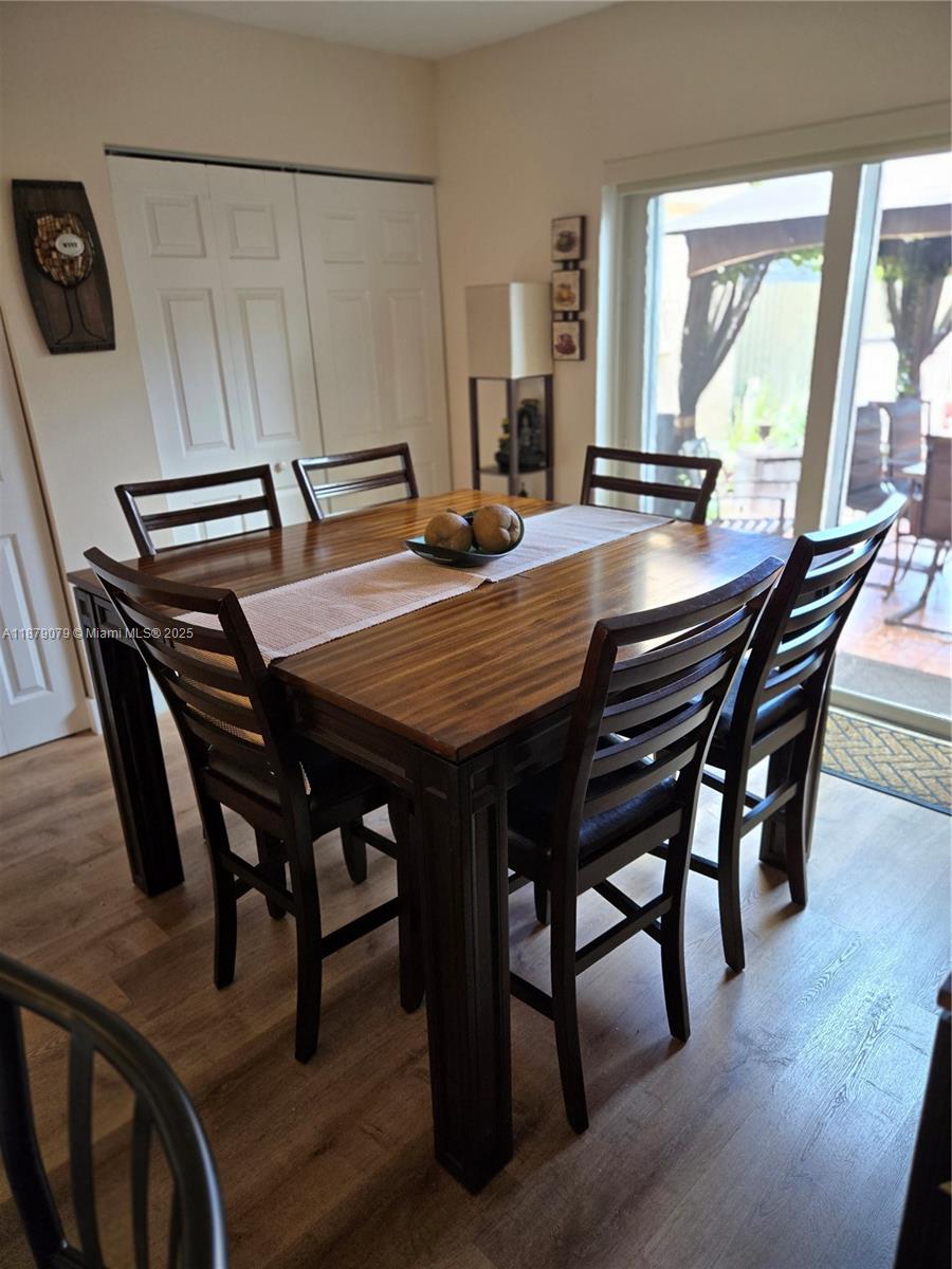 12095 Southwest 18th Terrace, Unit 267 Miami, FL 33175 - Photo 19 of 45 a dining room with furniture window and wooden floor