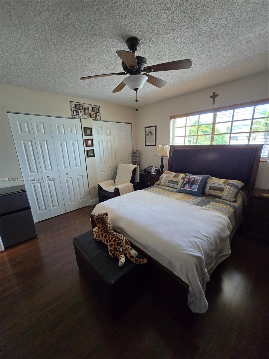 12095 Southwest 18th Terrace, Unit 267 Miami, FL 33175 - Photo 23 of 45 a bedroom with a bed and window