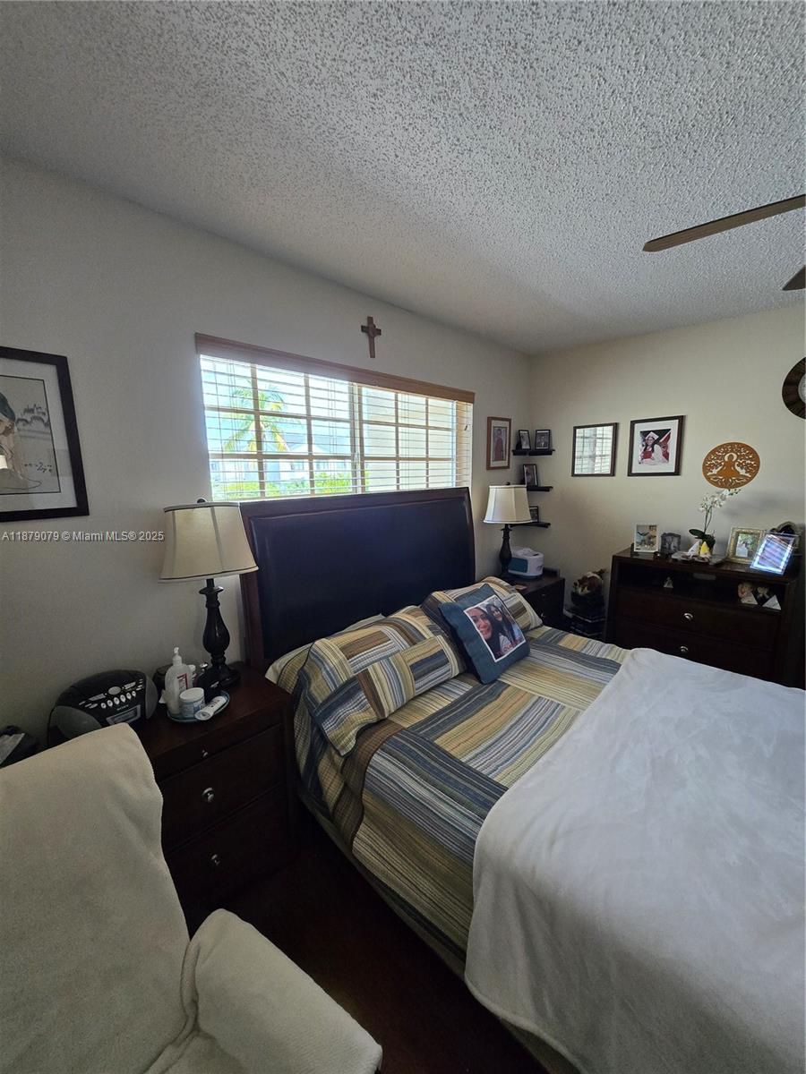 12095 Southwest 18th Terrace, Unit 267 Miami, FL 33175 - Photo 25 of 45 a bedroom with double bed and a window