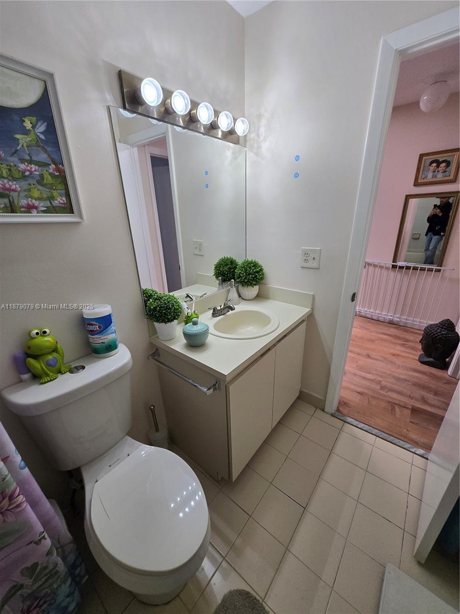 12095 Southwest 18th Terrace, Unit 267 Miami, FL 33175 - Photo 28 of 45 a bathroom with a sink and mirror