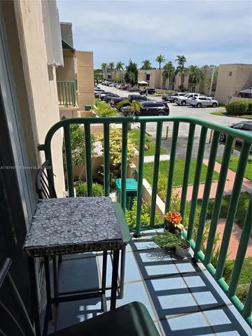 a view of a balcony with wooden floor