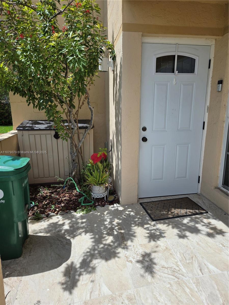 12095 Southwest 18th Terrace, Unit 267 Miami, FL 33175 - Photo 4 of 45 a view of a backyard of the house
