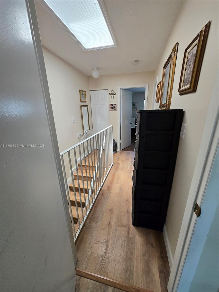 12095 Southwest 18th Terrace, Unit 267 Miami, FL 33175 - Photo 43 of 45 a view of entryway and hall with wooden floor