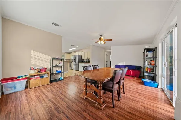 a dining room with a wooden floor and breakfast area