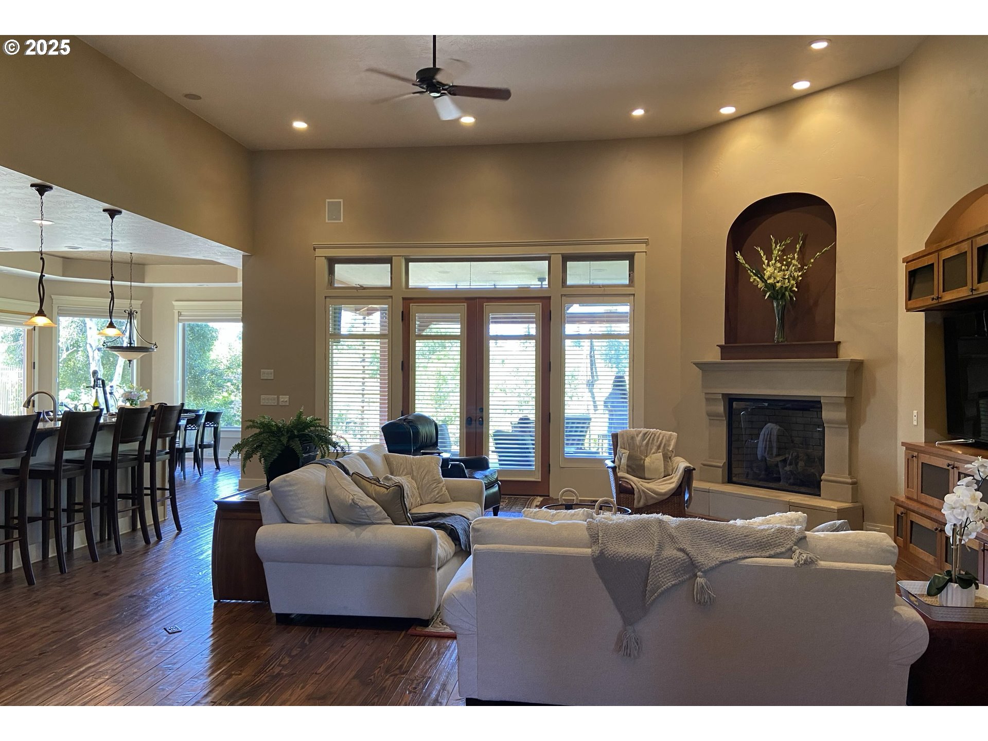 625 St Andrews Loop Creswell, OR 97426 - Photo 8 of 31 a living room with fireplace furniture and a large window