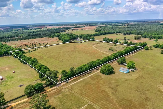 a view of a swimming pool with an outdoor seating