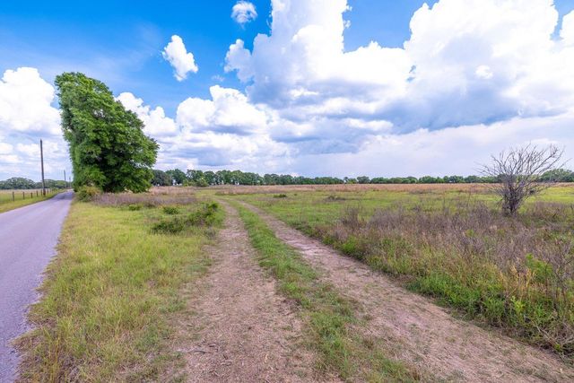 a view of a yard with an outdoor space