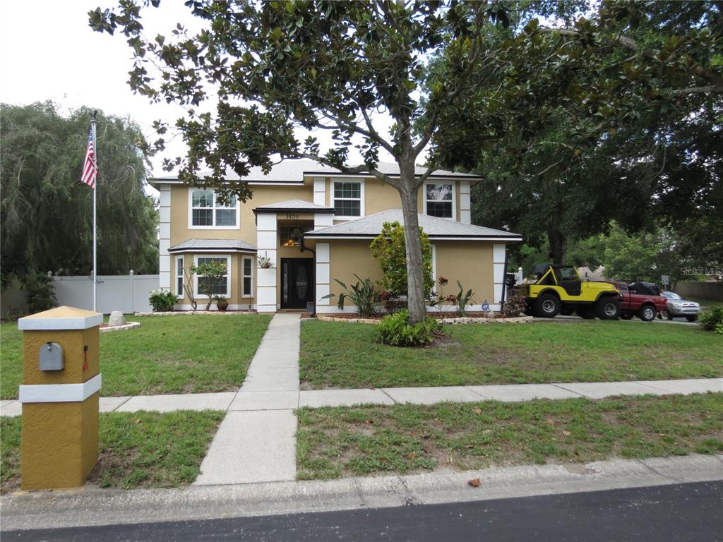1420 Center Street Ocoee, FL 34761 - Photo 1 of 1 a front view of a house with a garden and trees