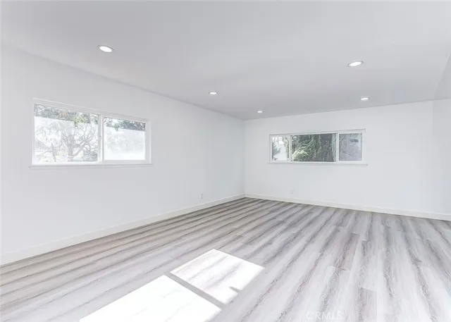 a view of an empty room and a window