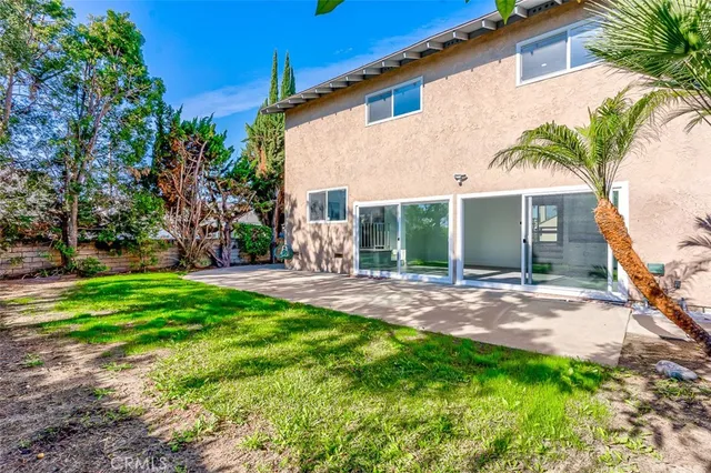a view of a backyard with a sitting area