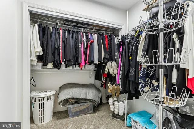 a bathroom with a granite countertop sink a toilet and a mirror