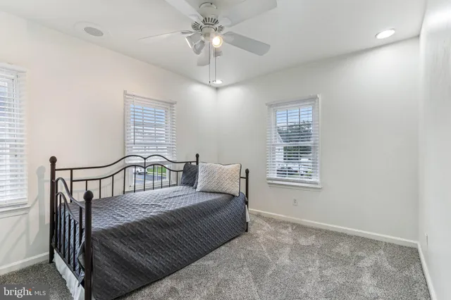 a bedroom with furniture and a chandelier