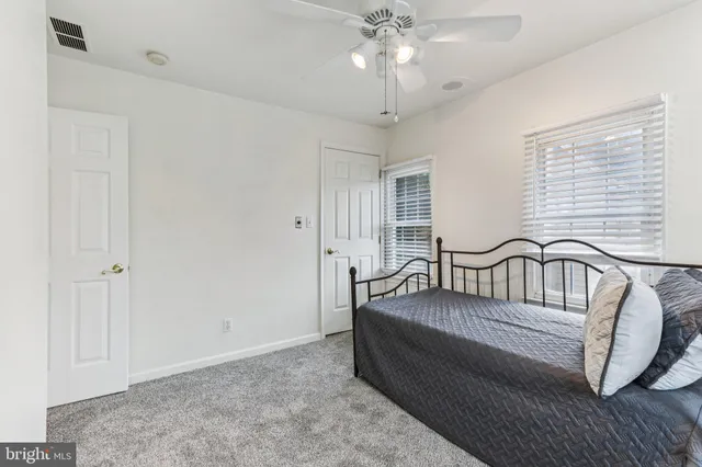 a view of a livingroom with furniture and a window