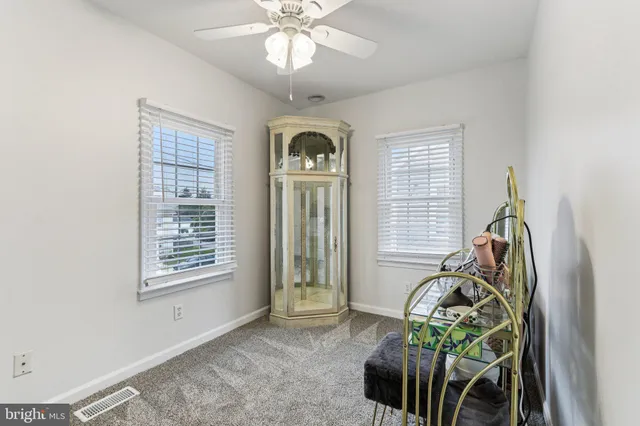 a view of livingroom with furniture and windows