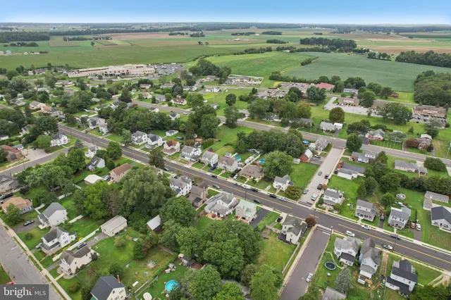 an aerial view of a city with mountains