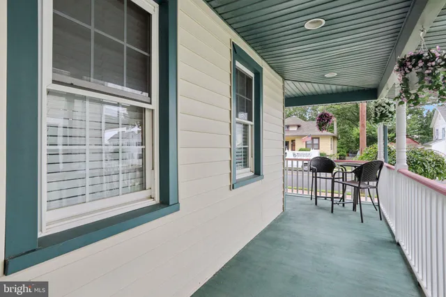 a bunch of flowers in front of a house
