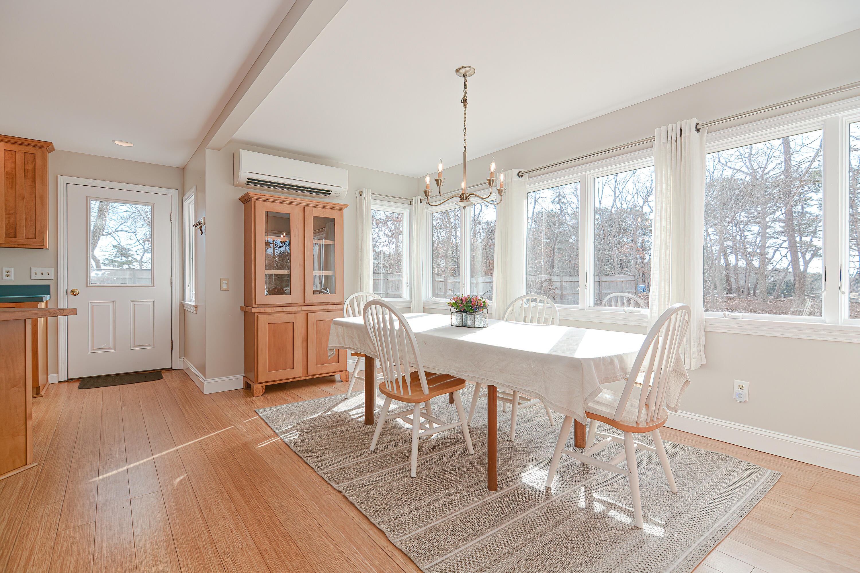 155 Gross Hill Road Wellfleet, MA 02667 - Photo 16 of 52 a view of a dining room with furniture window and wooden floor