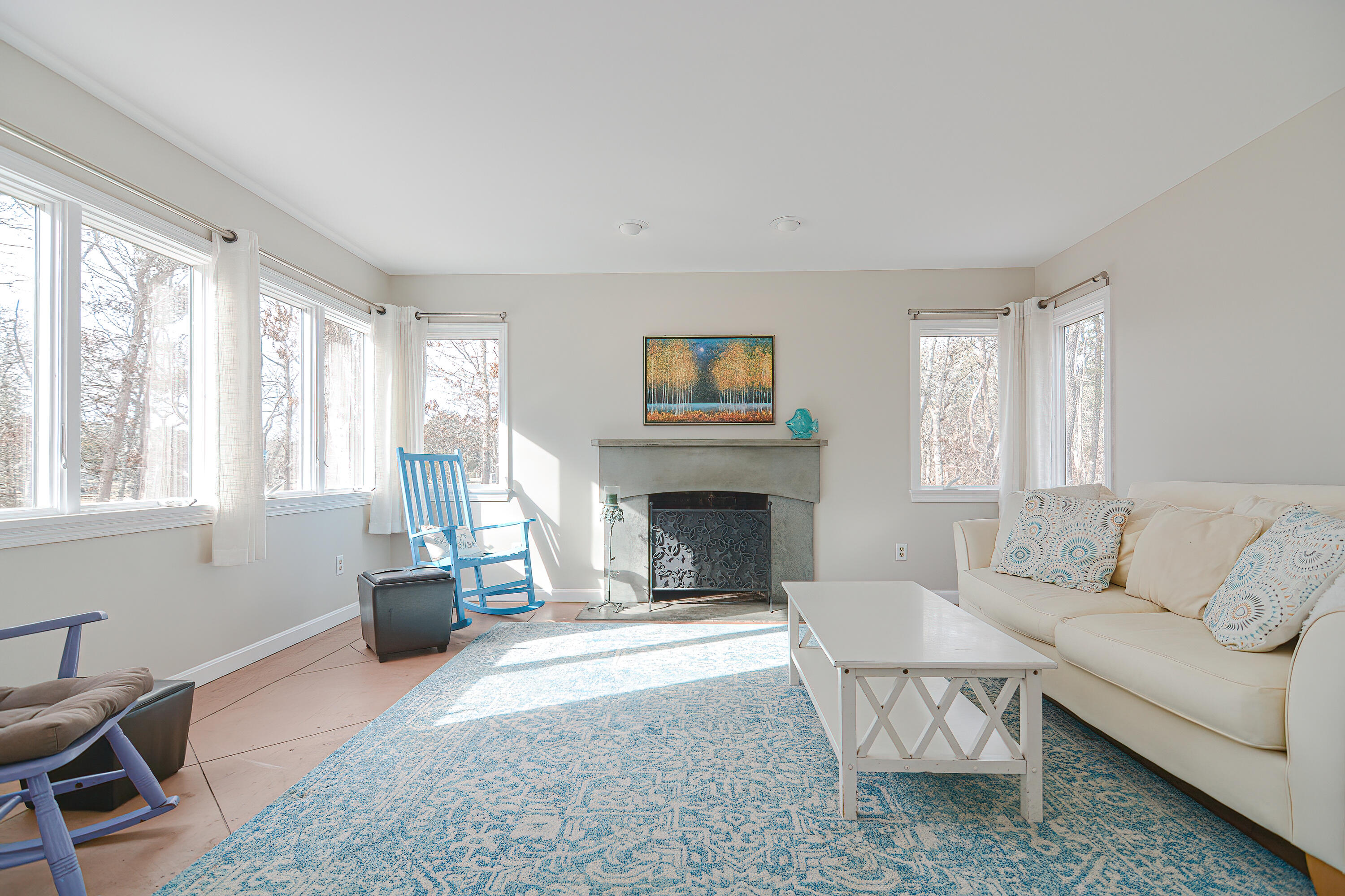 155 Gross Hill Road Wellfleet, MA 02667 - Photo 18 of 52 a living room with furniture and a fireplace