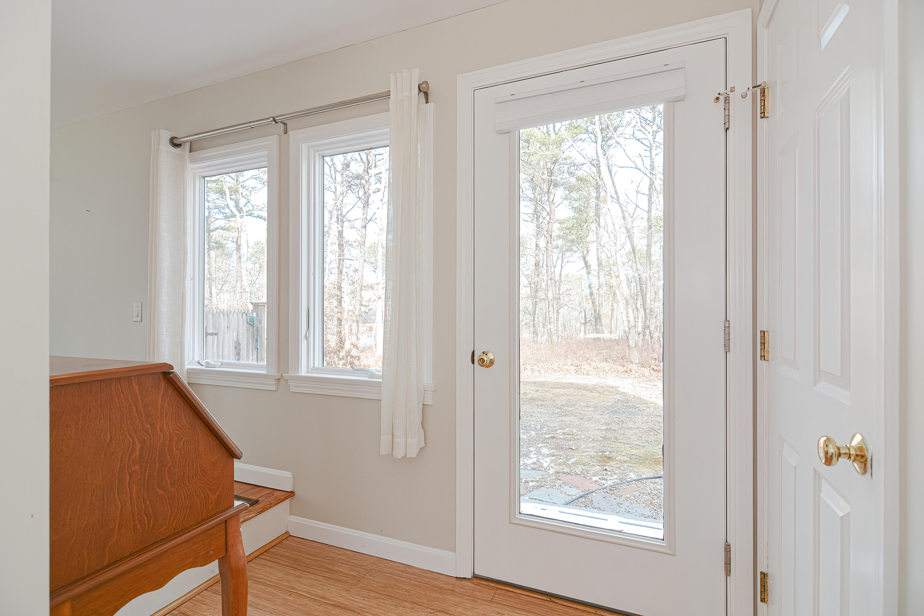 155 Gross Hill Road Wellfleet, MA 02667 - Photo 25 of 52 a view of an empty room with wooden floor and a window
