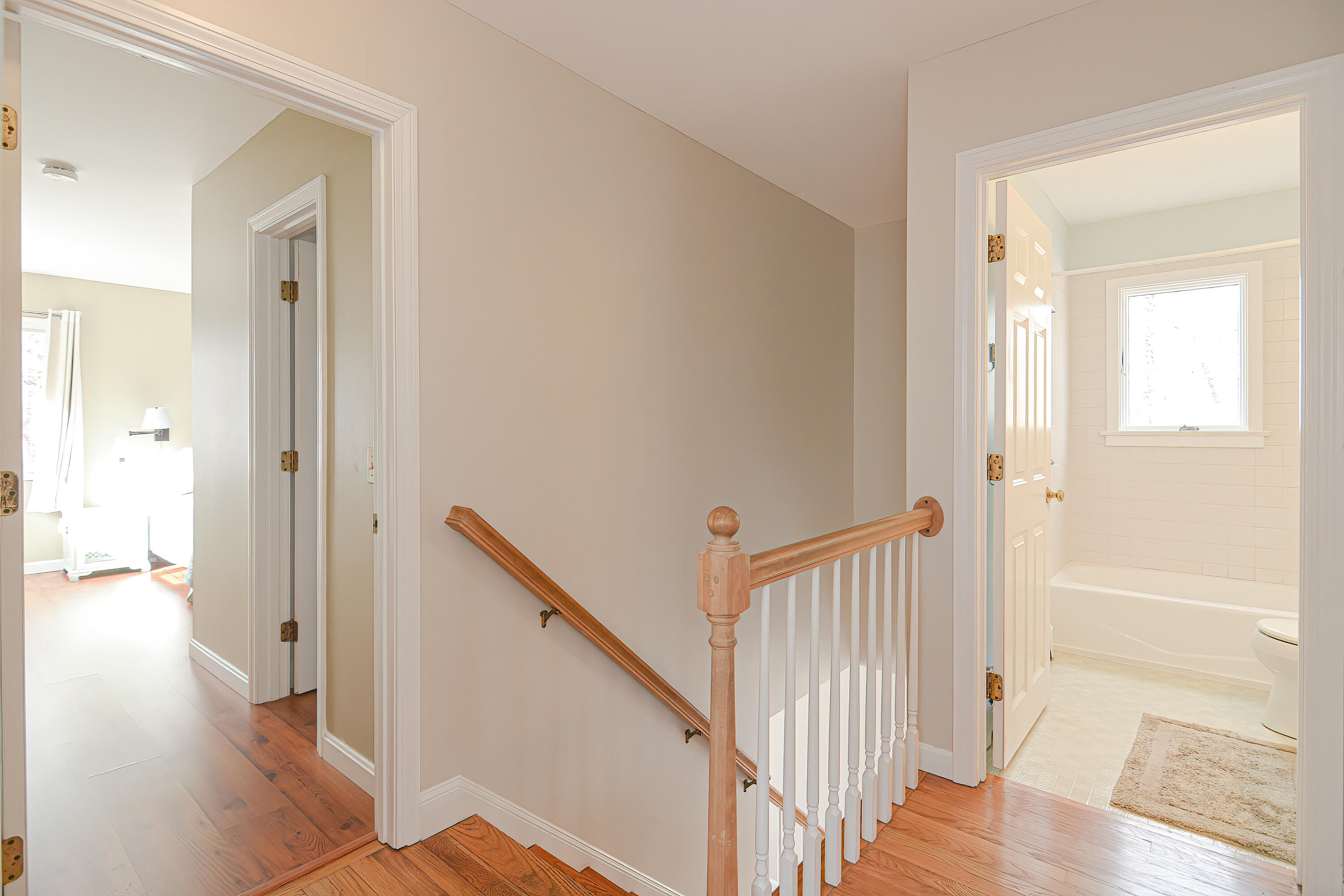 155 Gross Hill Road Wellfleet, MA 02667 - Photo 28 of 52 a view of a hallway with wooden floor and staircase