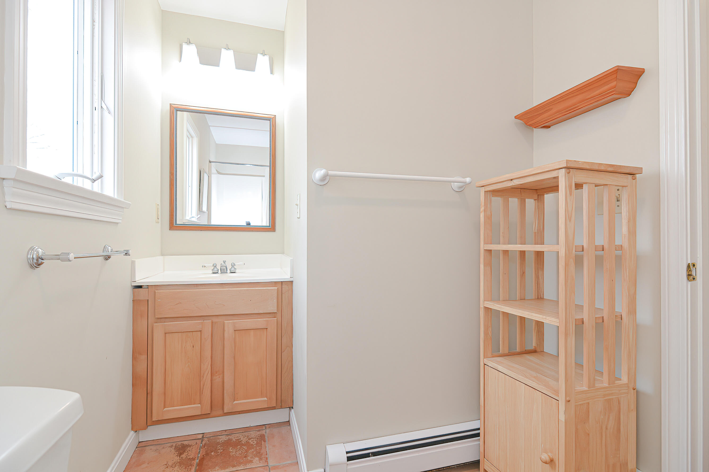 155 Gross Hill Road Wellfleet, MA 02667 - Photo 34 of 52 a view of an empty room with cabinet and a window