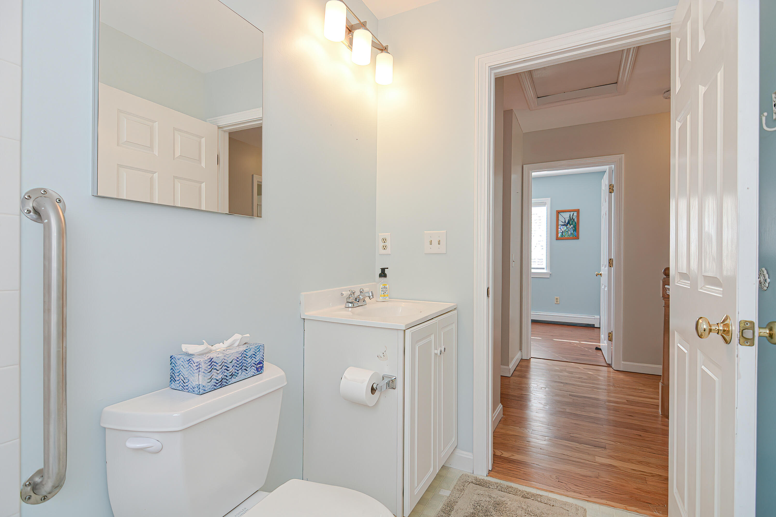 155 Gross Hill Road Wellfleet, MA 02667 - Photo 39 of 52 a bathroom with a toilet sink and mirror