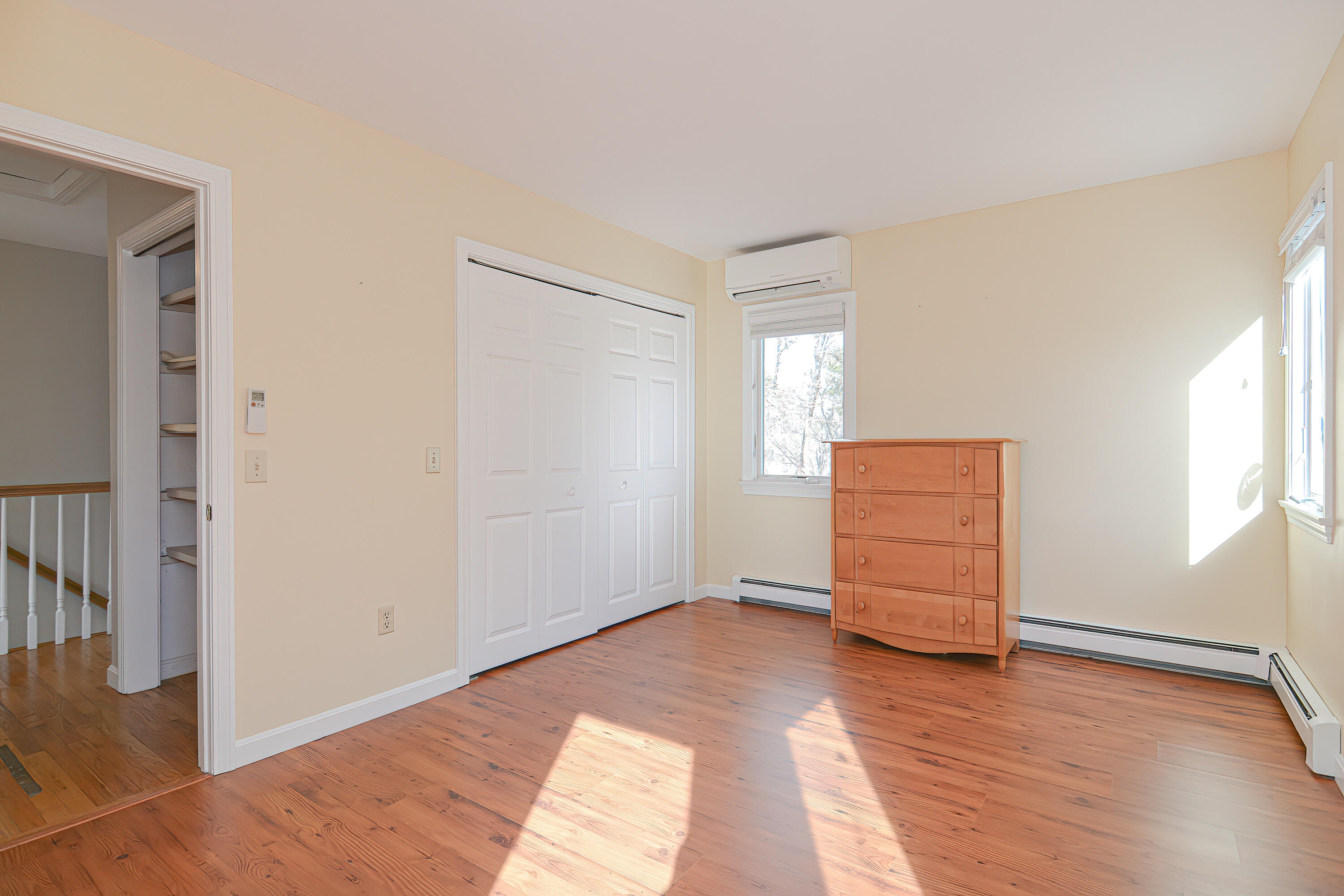 155 Gross Hill Road Wellfleet, MA 02667 - Photo 44 of 52 an empty room with wooden floor and closet