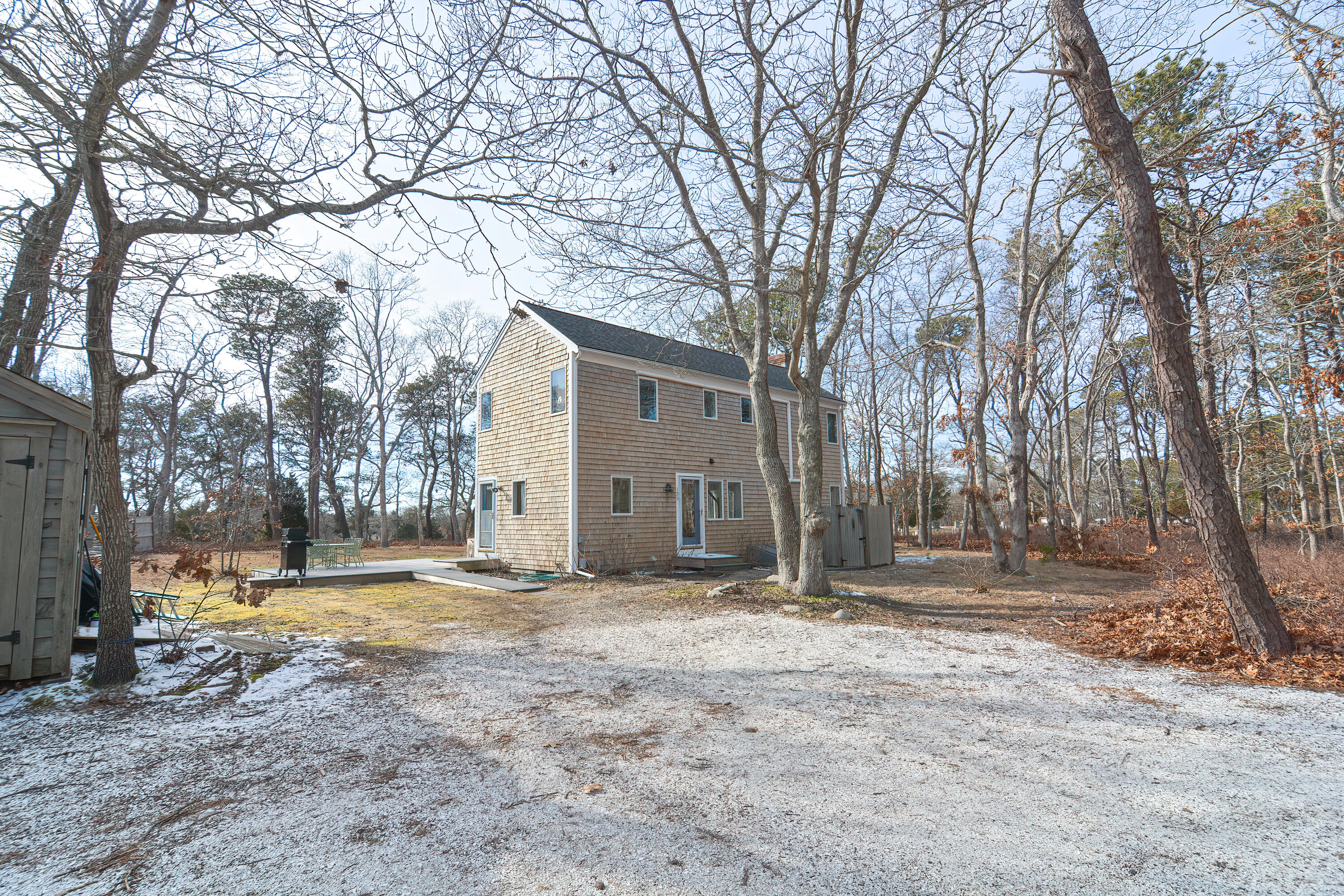 155 Gross Hill Road Wellfleet, MA 02667 - Photo 7 of 52 a view of a yard with a large tree