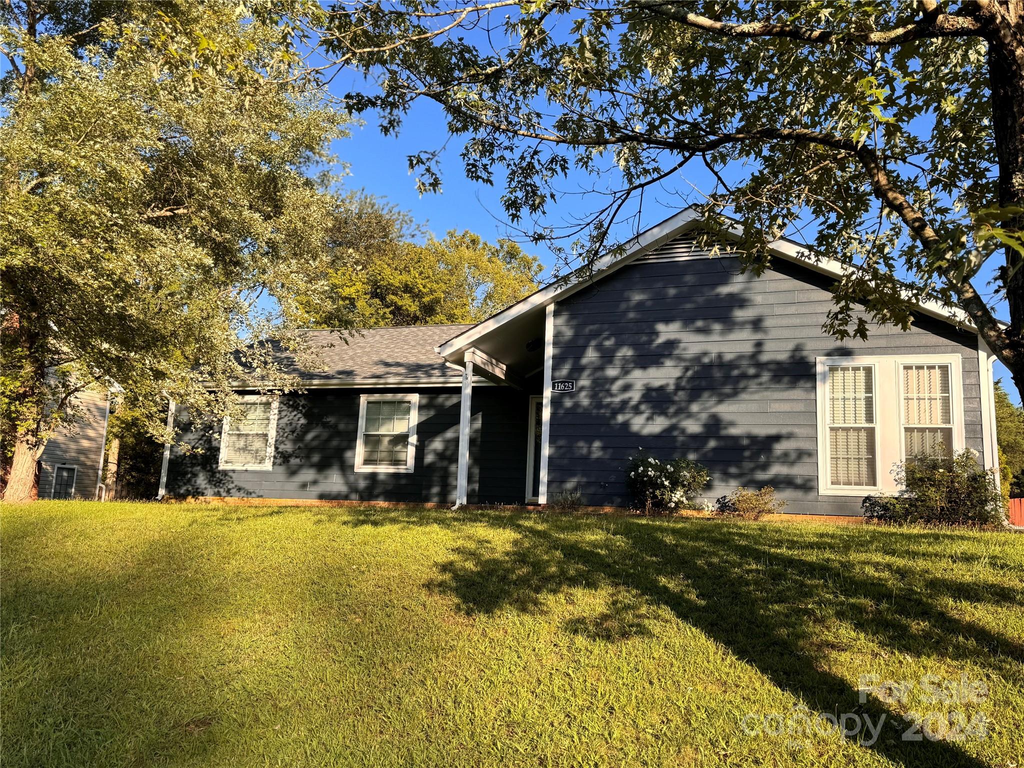 11625 Park Road Charlotte, NC 28226 - Photo 1 of 28 a view of a house with a large tree