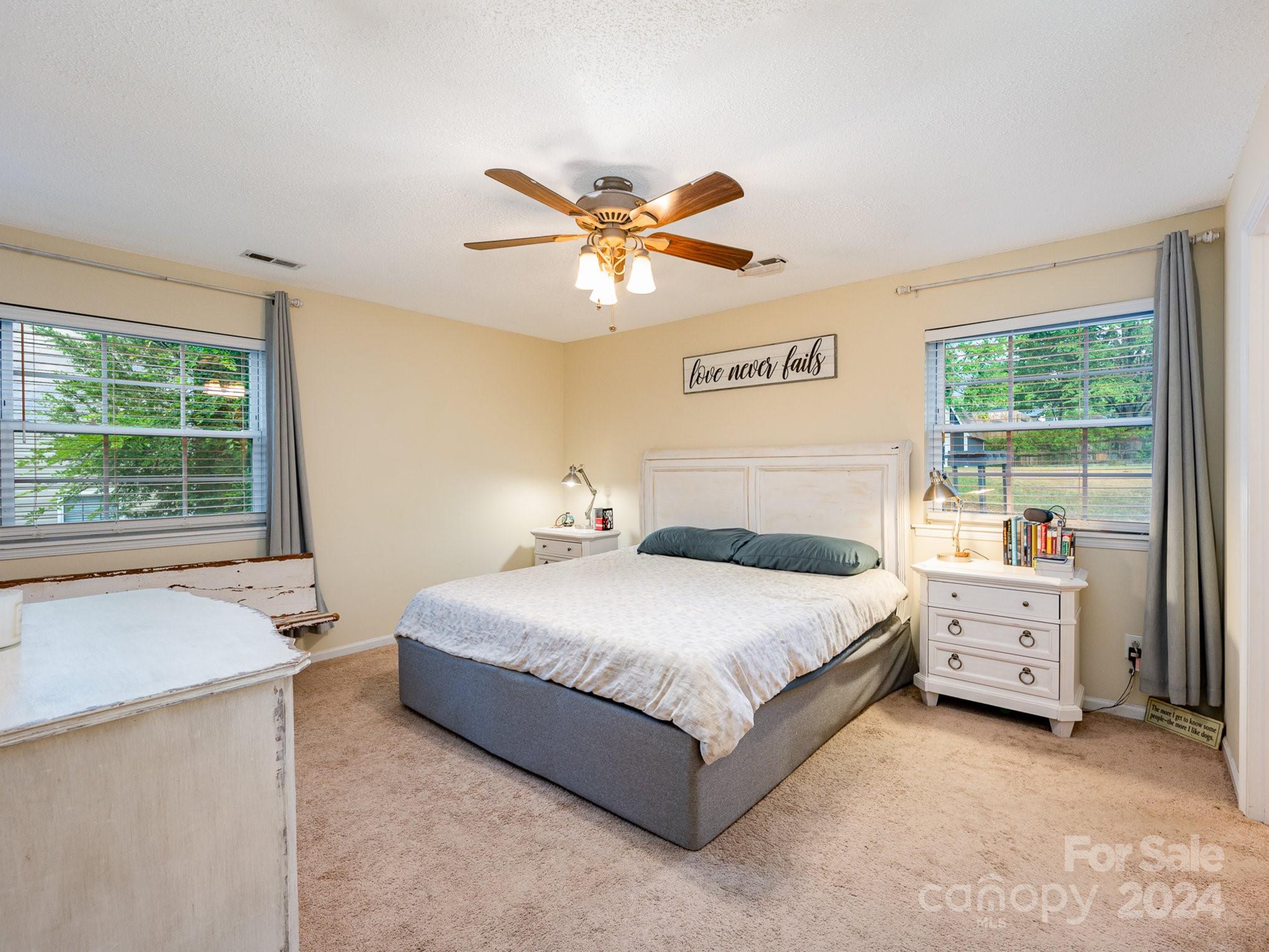 11625 Park Road Charlotte, NC 28226 - Photo 11 of 28 a spacious bedroom with a bed and a large window