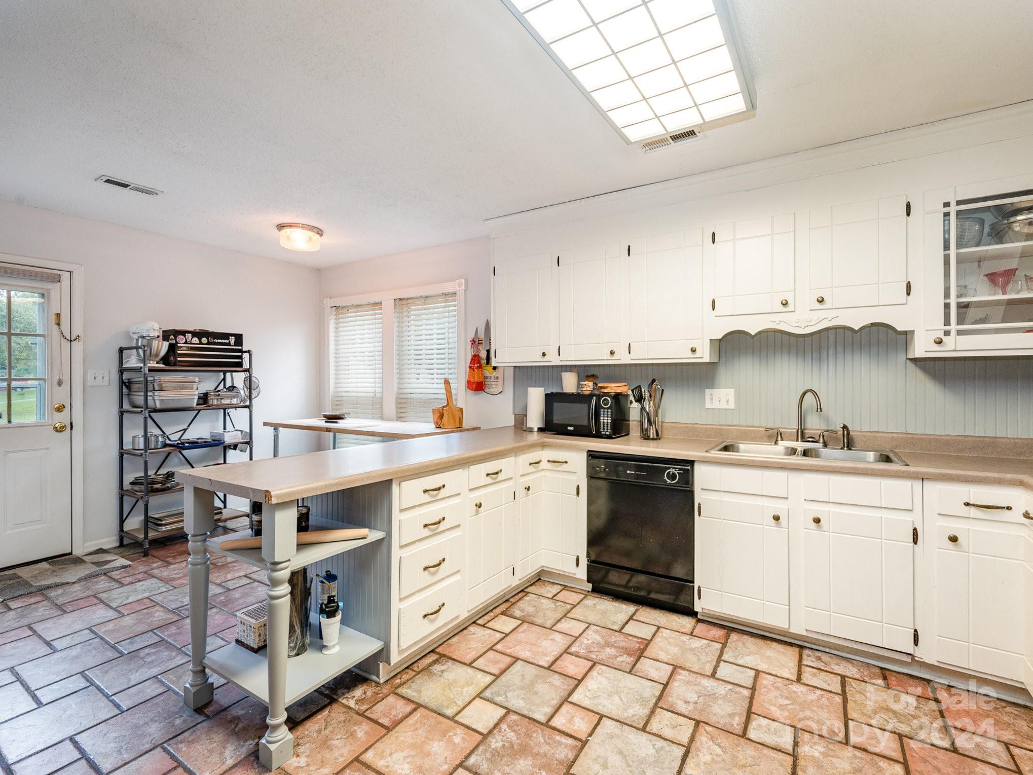11625 Park Road Charlotte, NC 28226 - Photo 17 of 28 a kitchen with stainless steel appliances granite countertop a stove a sink dishwasher and a refrigerator