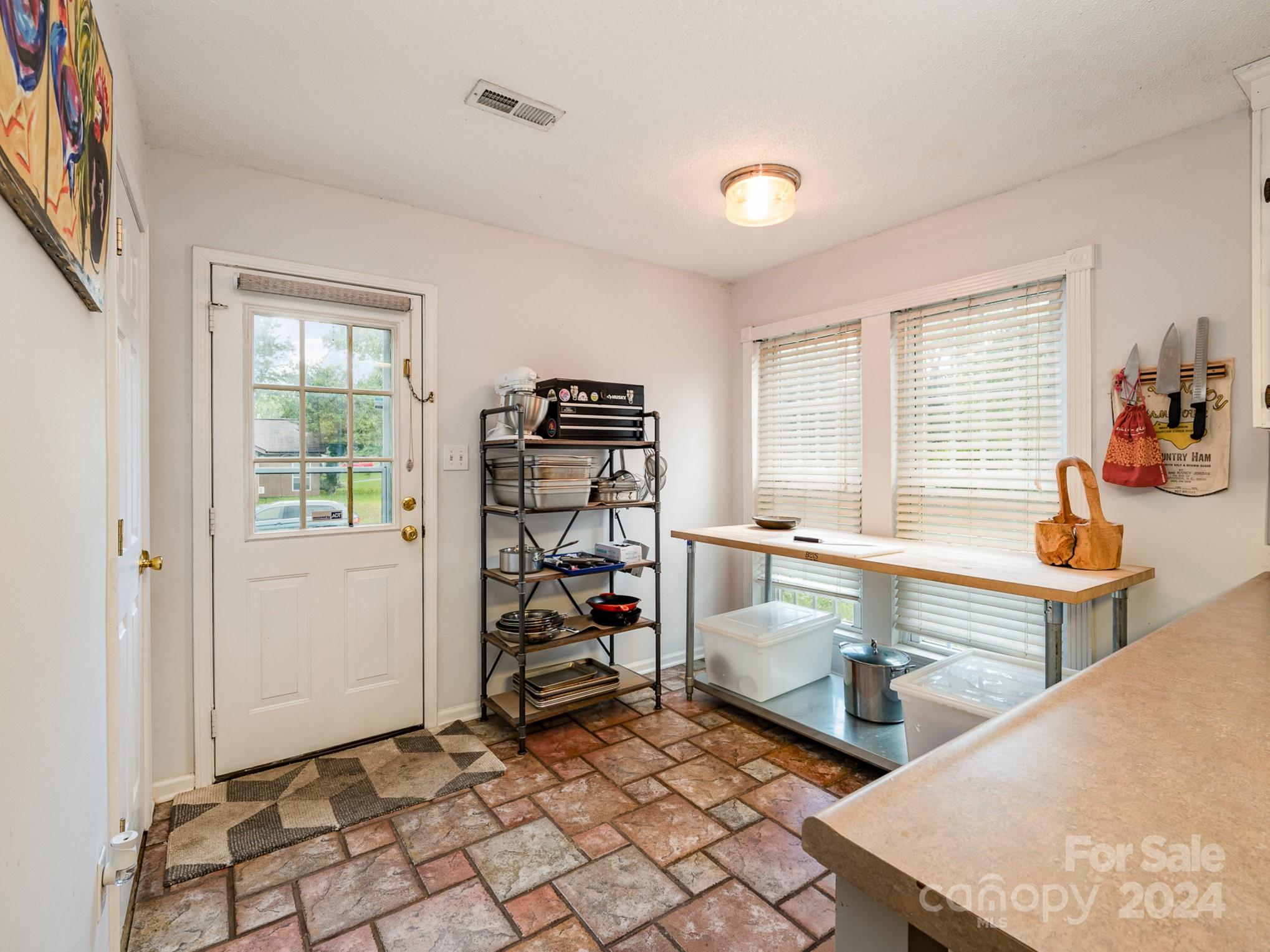 11625 Park Road Charlotte, NC 28226 - Photo 18 of 28 a kitchen with stainless steel appliances granite countertop a sink and a refrigerator