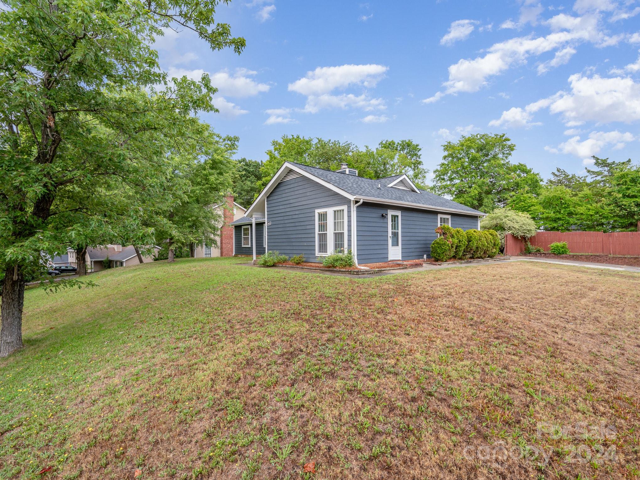 11625 Park Road Charlotte, NC 28226 - Photo 25 of 28 a view of house that has a tree in front of it