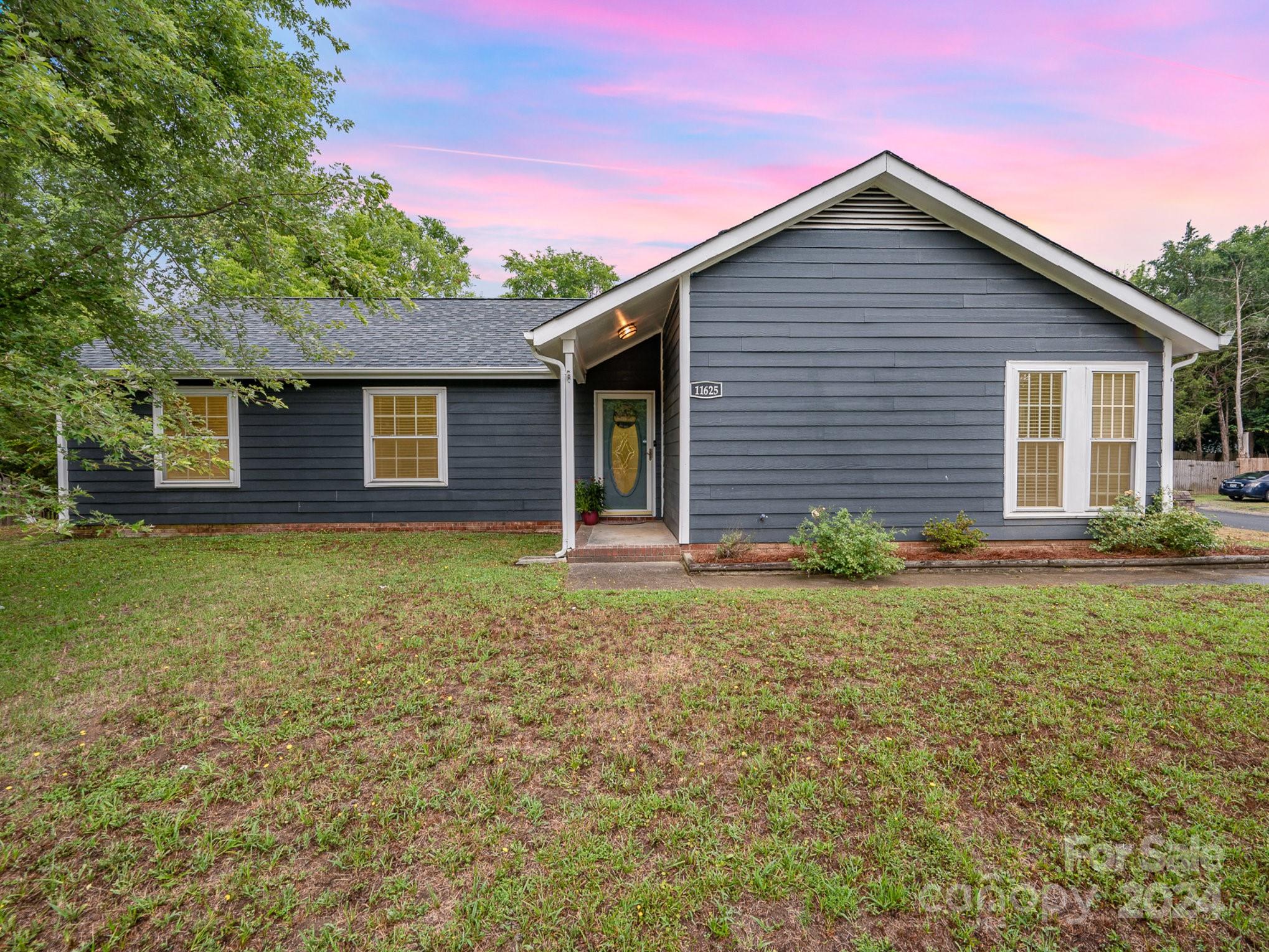 11625 Park Road Charlotte, NC 28226 - Photo 27 of 28 a front view of a house with garden