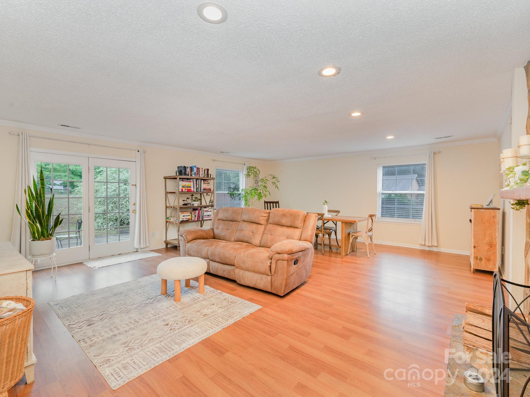 11625 Park Road Charlotte, NC 28226 - Photo 5 of 28 a living room with furniture and a wooden floor
