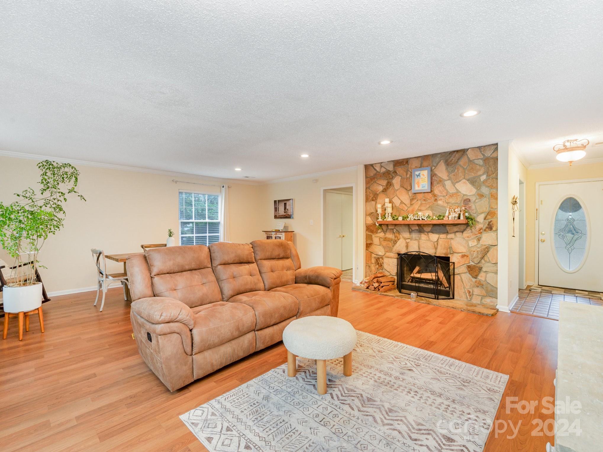 11625 Park Road Charlotte, NC 28226 - Photo 8 of 28 a living room with furniture and a fireplace