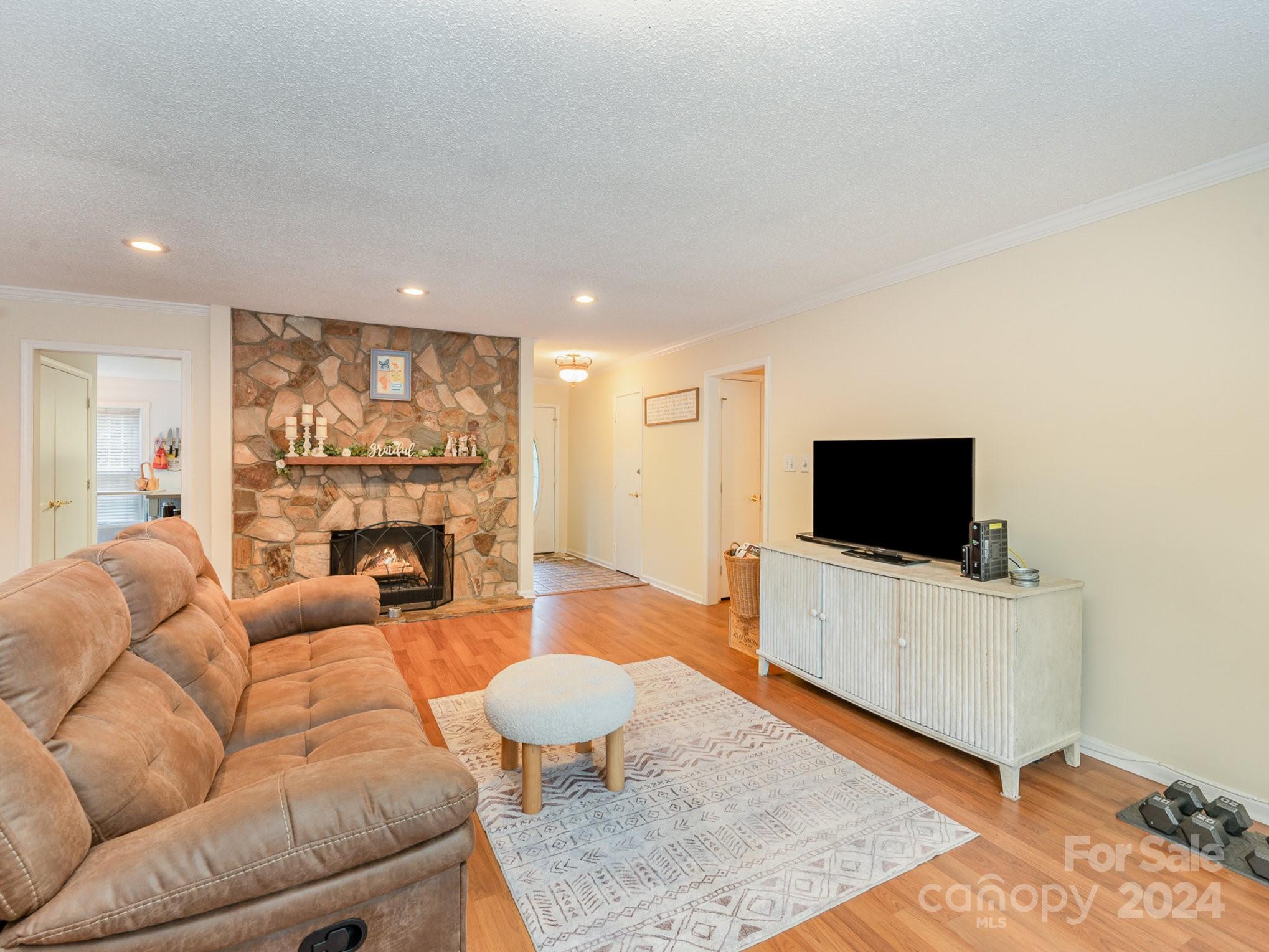11625 Park Road Charlotte, NC 28226 - Photo 9 of 28 a living room with furniture and a flat screen tv