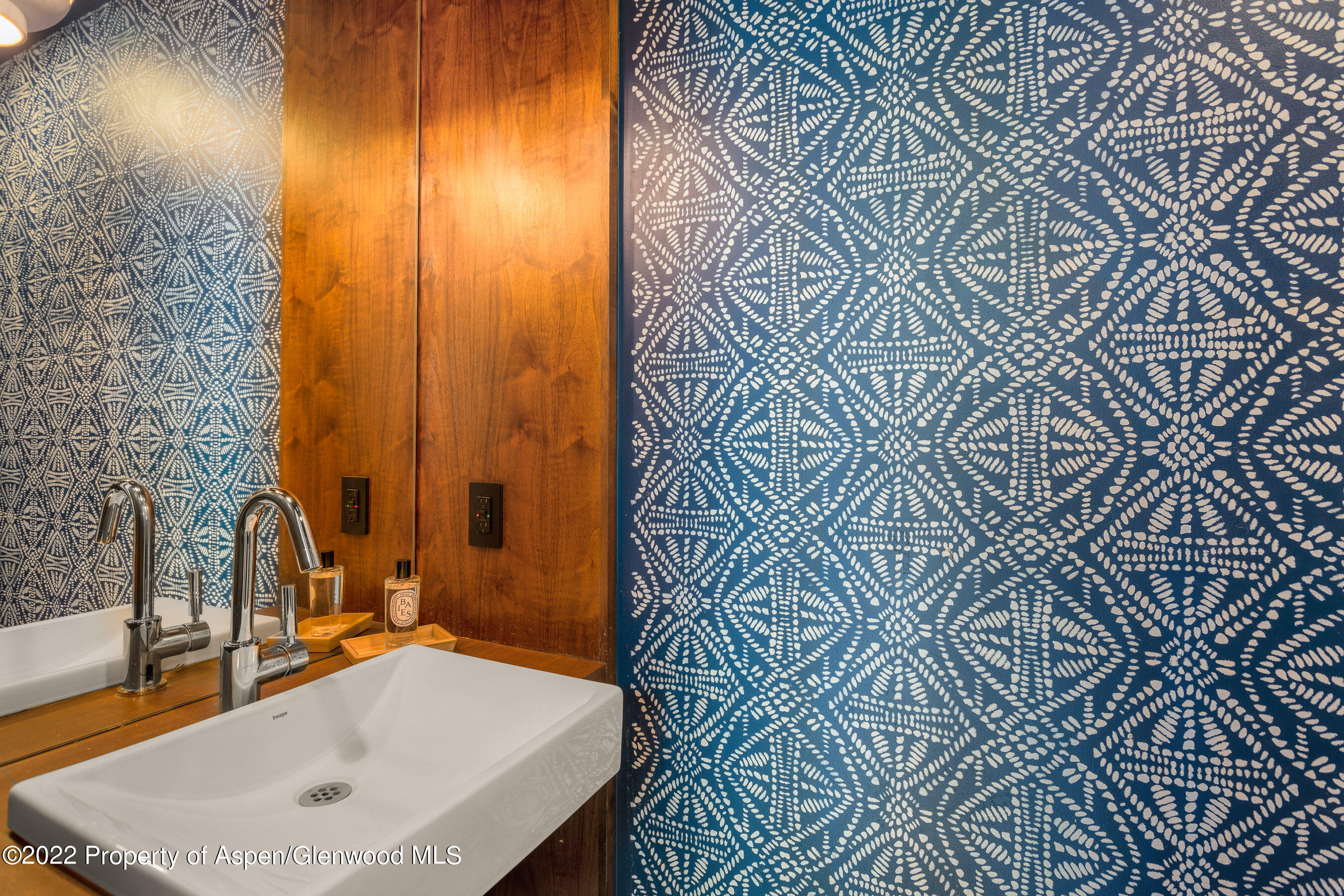 940 East Hyman Avenue Aspen, CO 81611 - Photo 14 of 32 a bathroom with a sink and a mirror