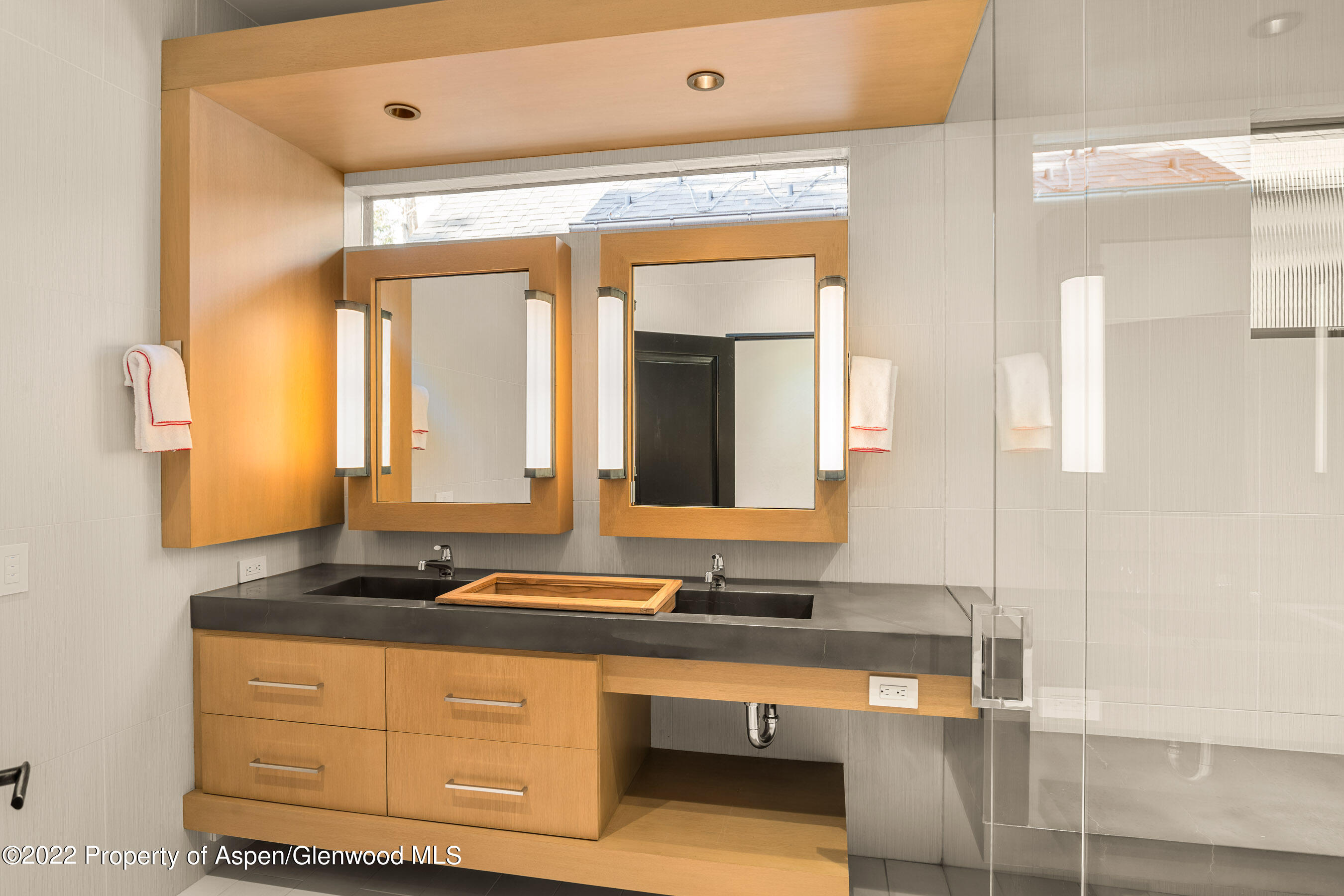 940 East Hyman Avenue Aspen, CO 81611 - Photo 17 of 32 a bathroom with a sink and a mirror