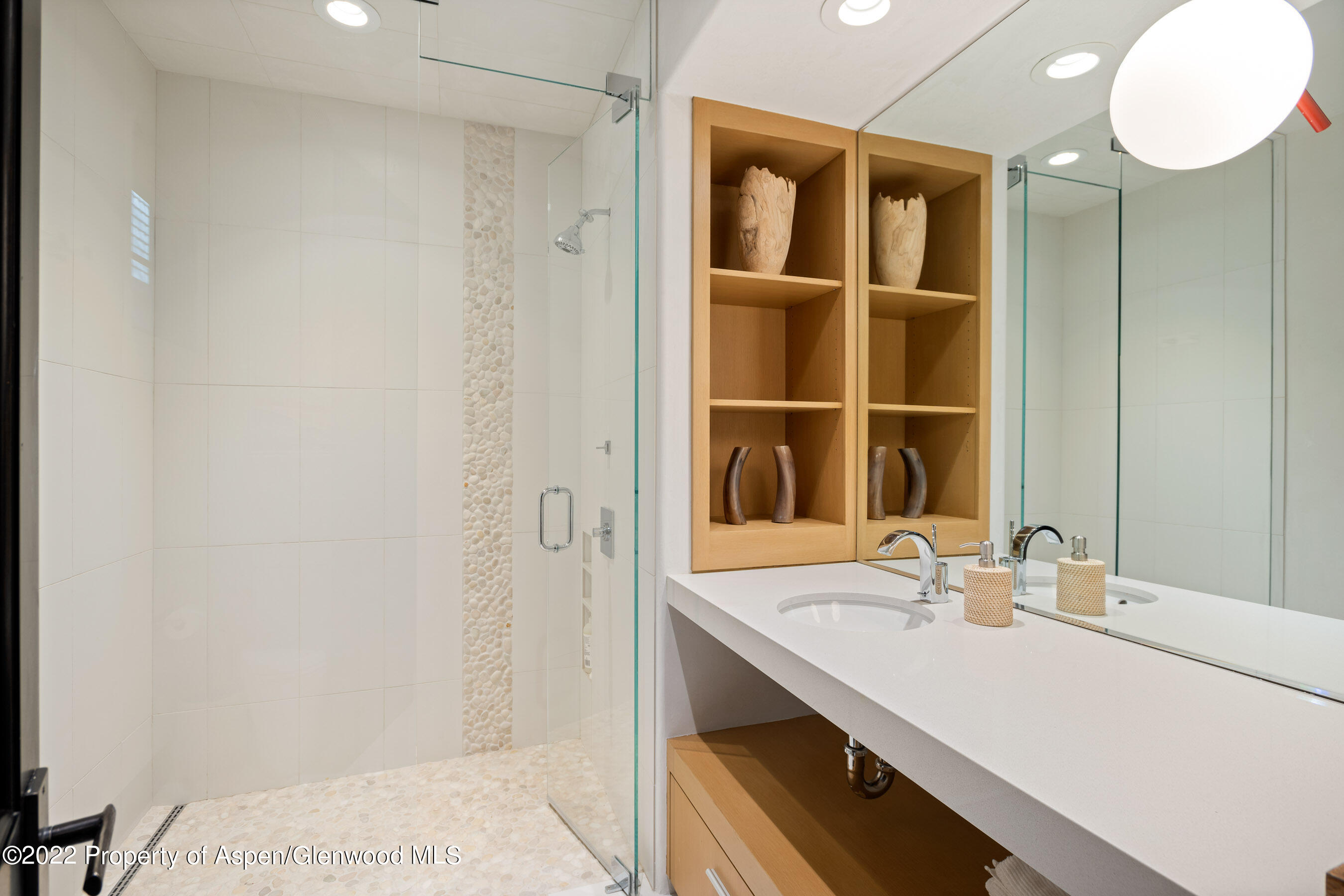 940 East Hyman Avenue Aspen, CO 81611 - Photo 21 of 32 a bathroom with a sink and a mirror