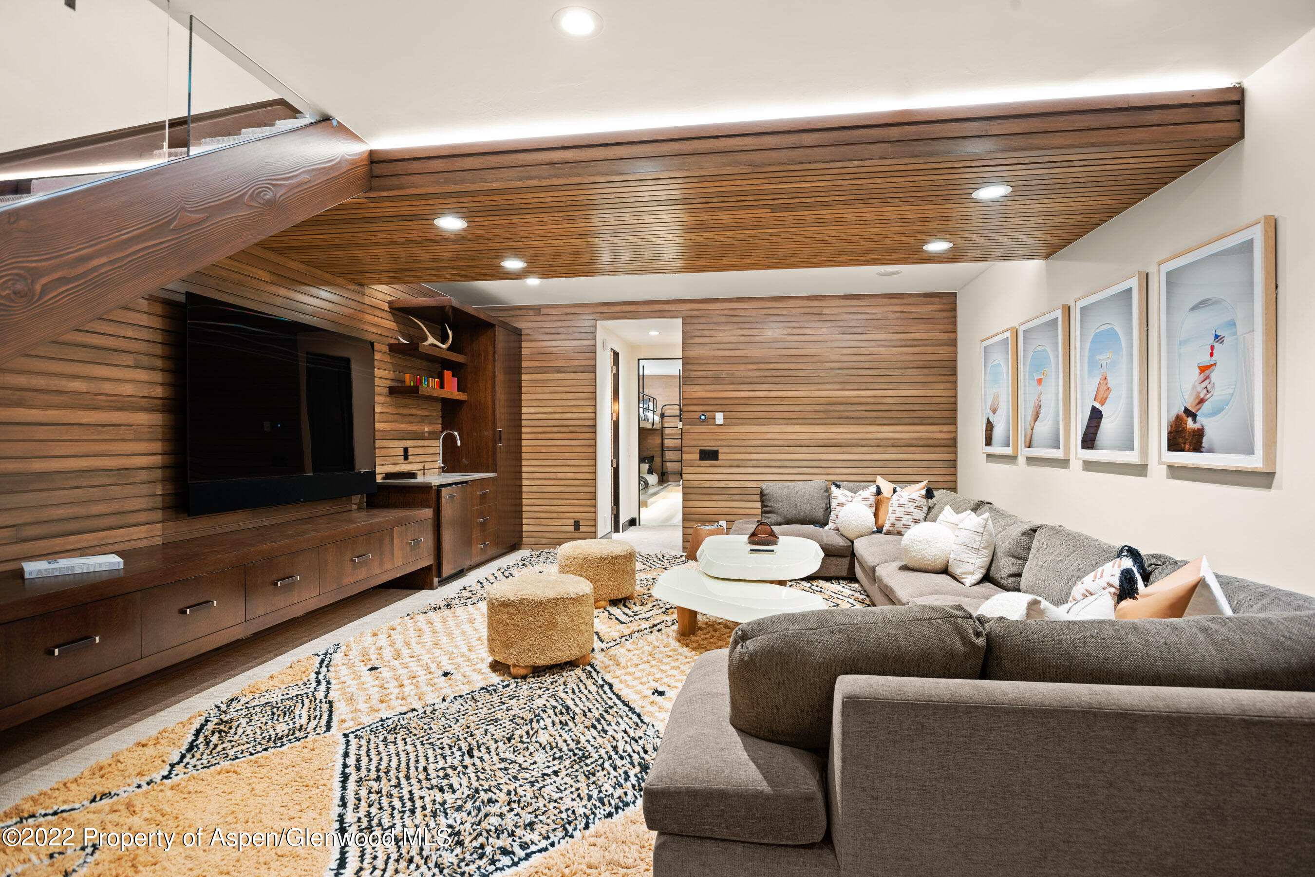 940 East Hyman Avenue Aspen, CO 81611 - Photo 24 of 32 a living room with furniture and a flat screen tv