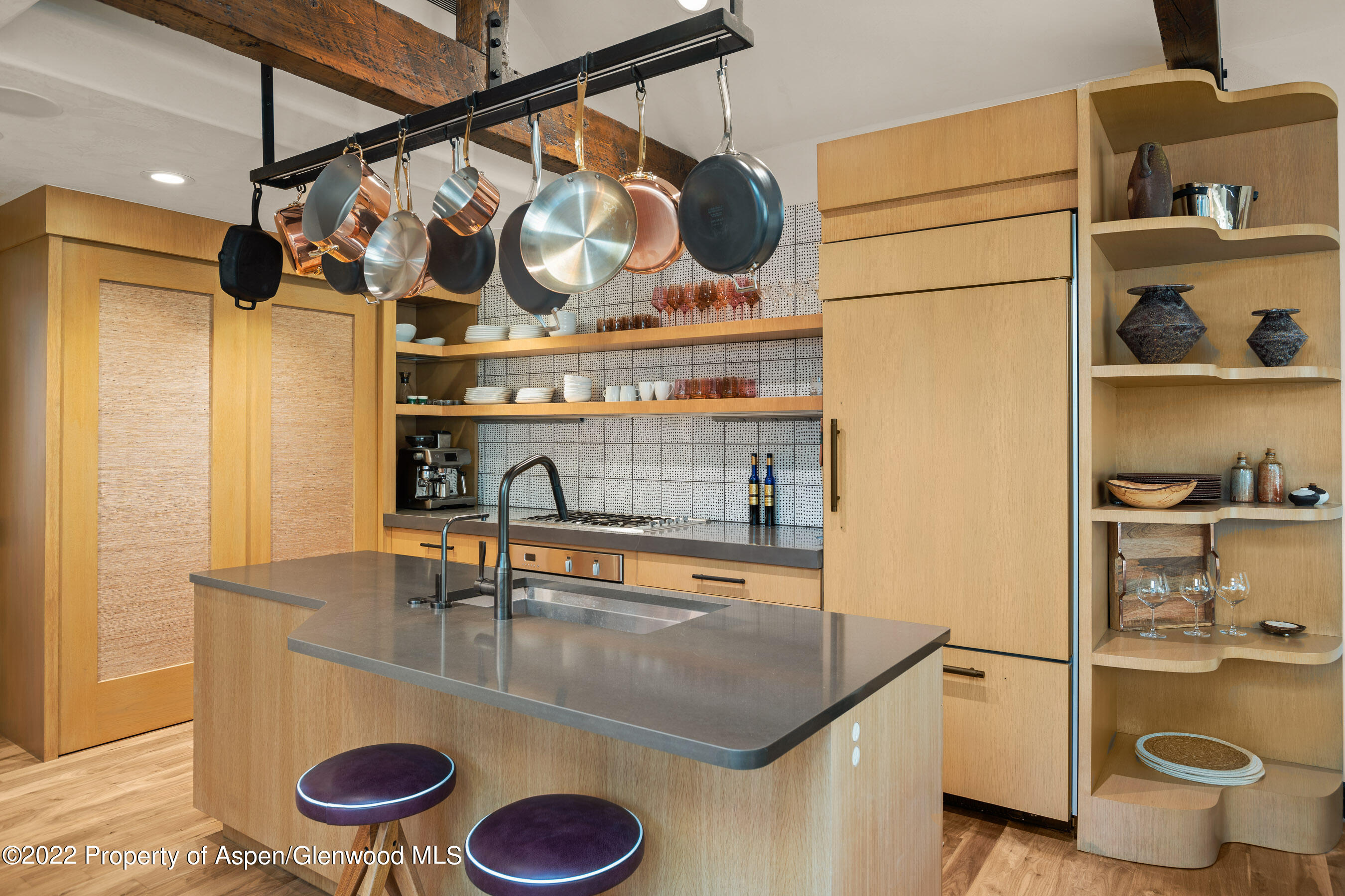 940 East Hyman Avenue Aspen, CO 81611 - Photo 9 of 32 a kitchen with a sink a stove and a refrigerator with wooden floor