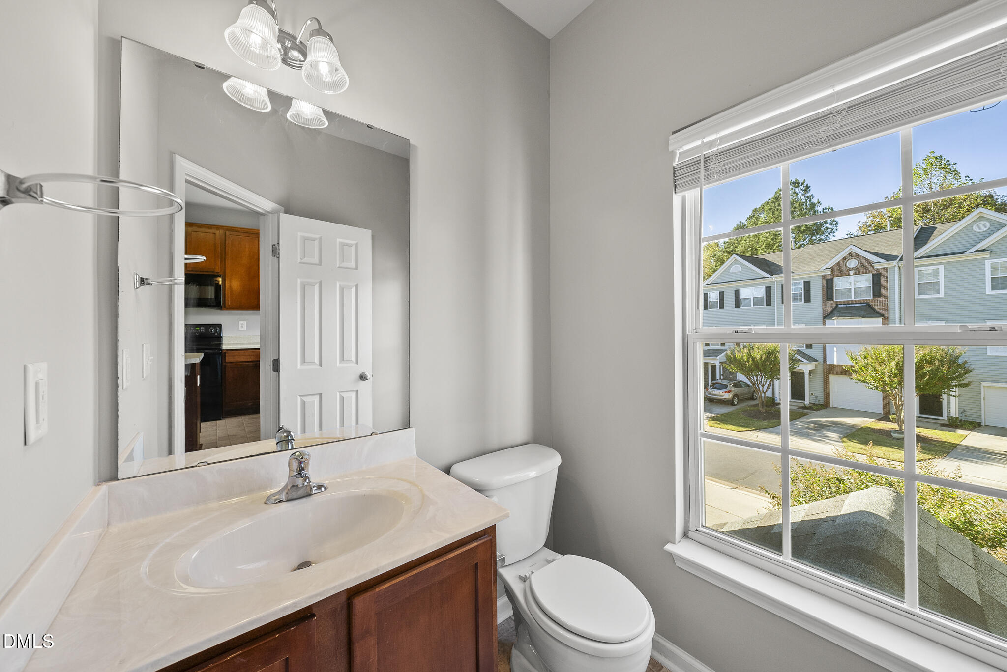 2615 Wyntercrest Lane Durham, NC 27713 - Photo 16 of 34 a bathroom with a sink a toilet and a mirror